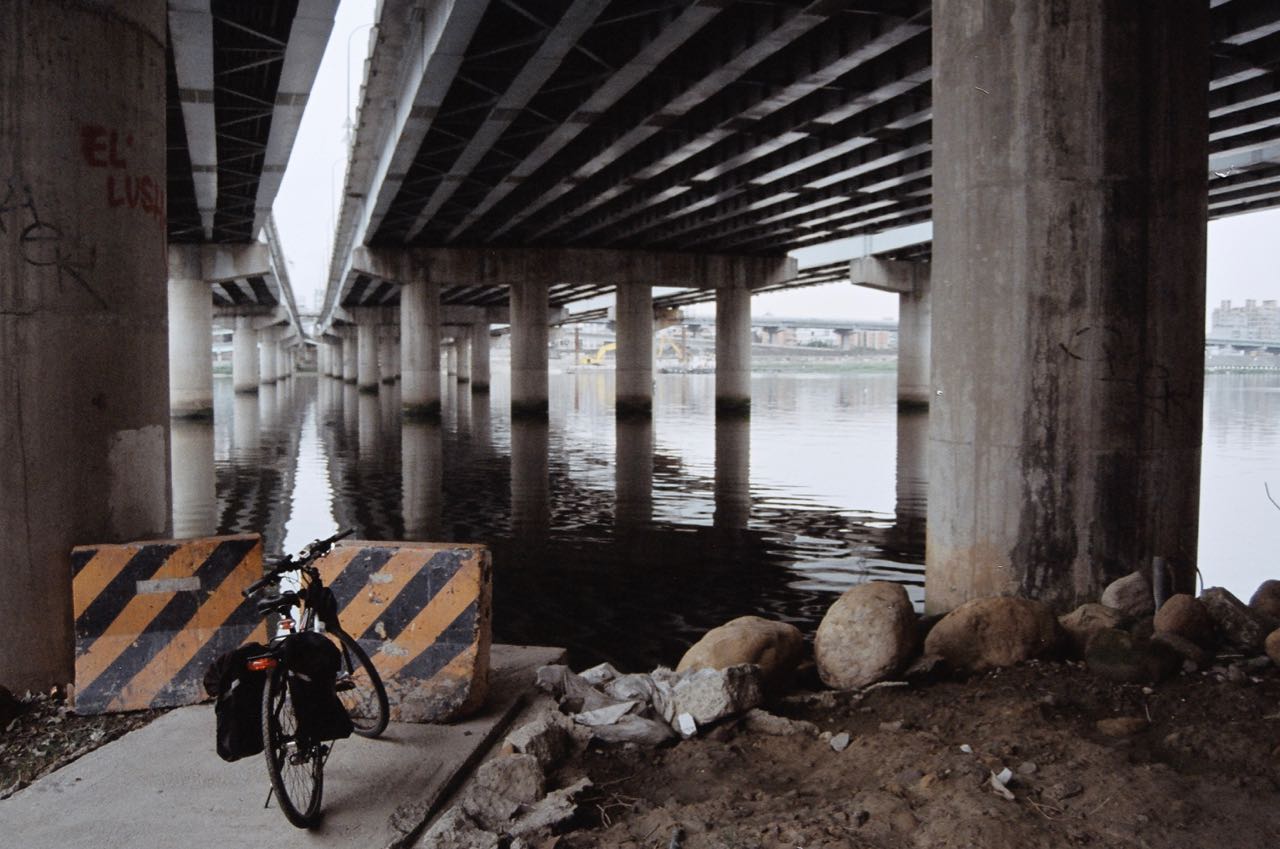 A bike and bridge columns