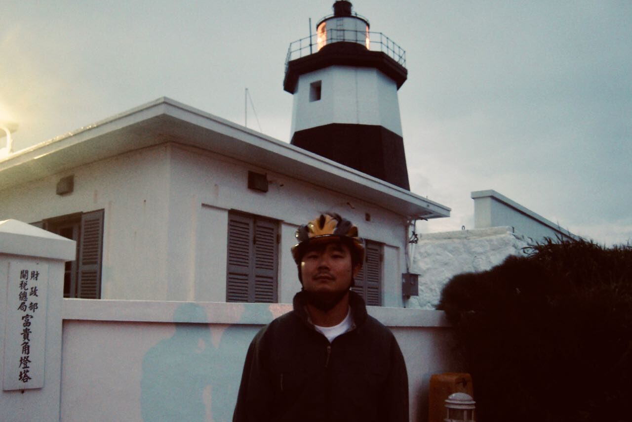 Cyclist in front of a Light House