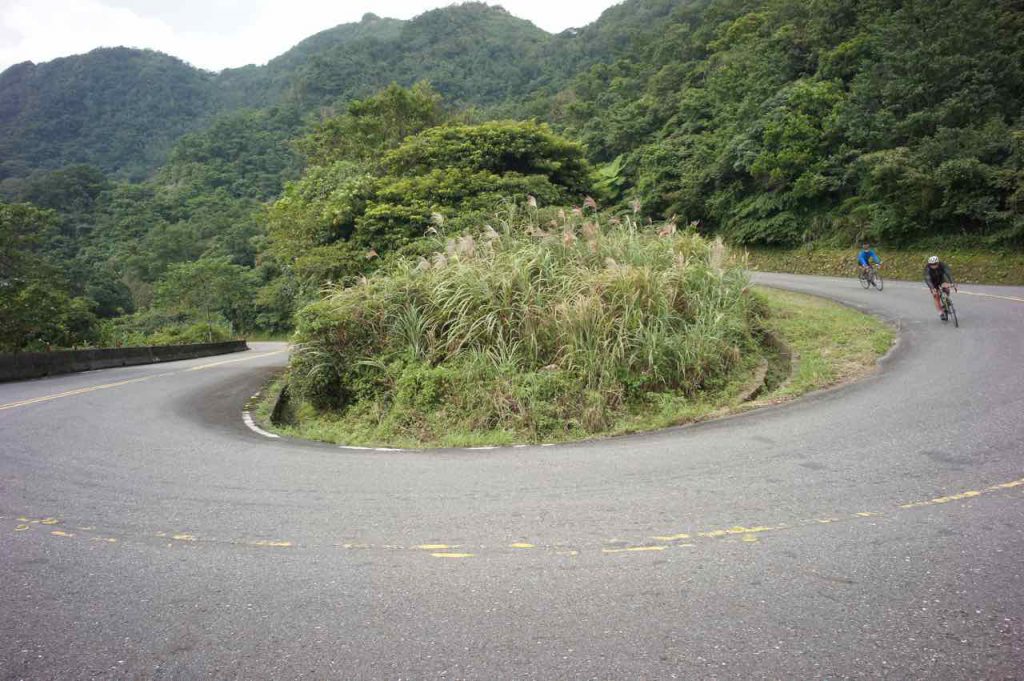 Hairpin turn descent with 2 cyclists